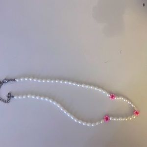 Pearl necklace with pink bead flowers